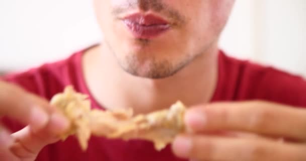 Attractive Hungry Young Man Eating Fast Food Meat Chicken Wings — Stock Video