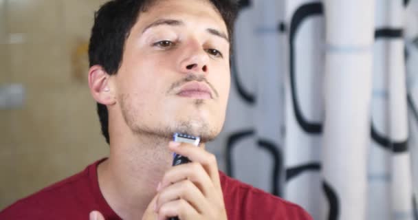 Young Attractive Man Shaving Electric Shaver Front Mirror Bathroom — Stock Video