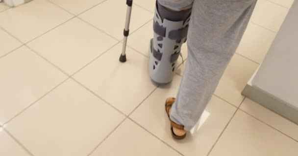 Woman Walking Hospital Corridor Crutches — Stock Video