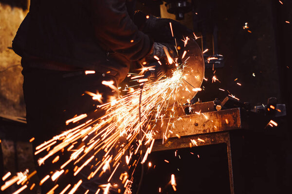 Working saws iron sparks