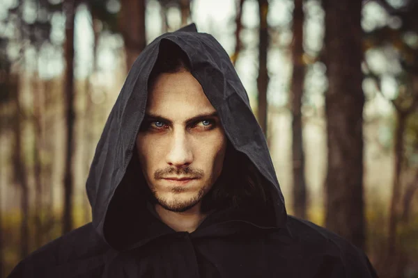 A monk in the hood — Stock Photo, Image