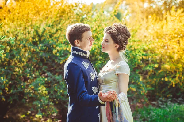 Beautiful couple in evening dress on the nature — Stock Photo, Image