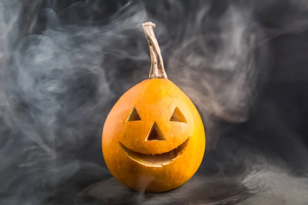 Jack o Lantern with smoke on dark background minimal creative concept.