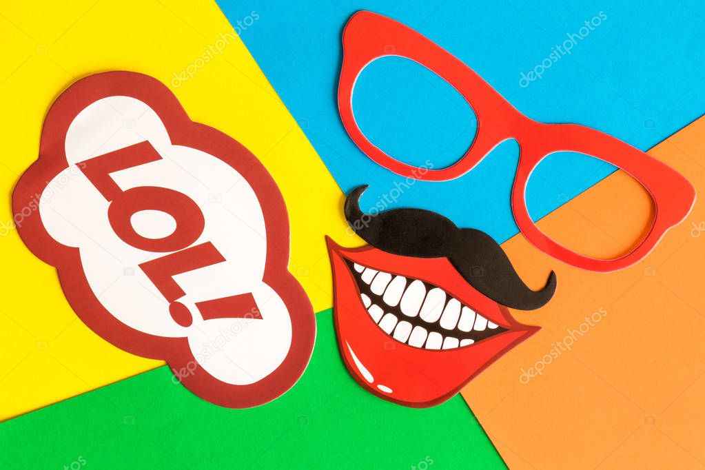 Party props on multicolored background abstract.