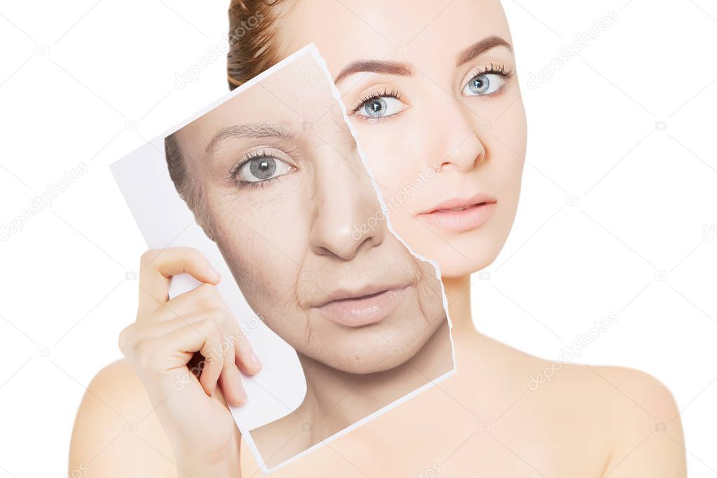 closeup portrait of young woman face holding portrait with old wrinkled face