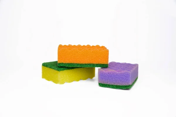 Kitchen scouring pads on a white background. Composition from sponges. Cleaning sponges.