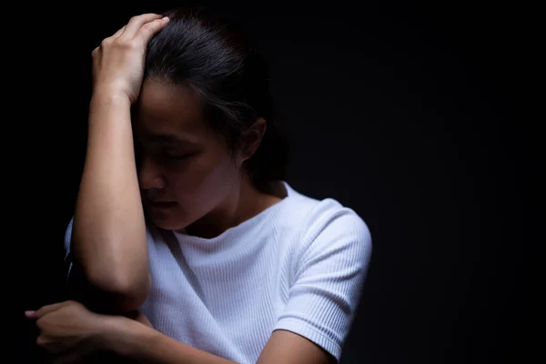 Sadness of a woman in the dark — Stock Photo, Image