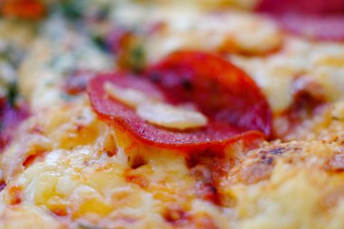 Macro shot pepperoni pizza.