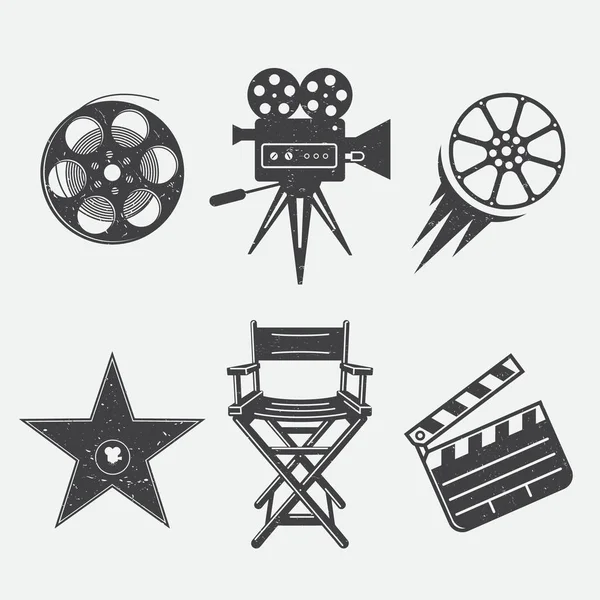 Vintage tarzda film ve üretim için farklı simgeler. Film kamerası, yıldız ödülü, film alkışı, kamera, bobin, sine-film ve yönetmen koltuğu.