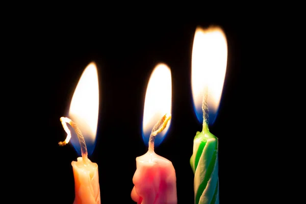 Three birthday candles on black background — Stock Photo, Image