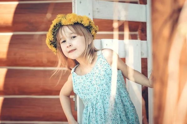 Portrait Little Caucasian Blond Girl Dandelion Wreath Posing Wooden Building — Stock Photo, Image