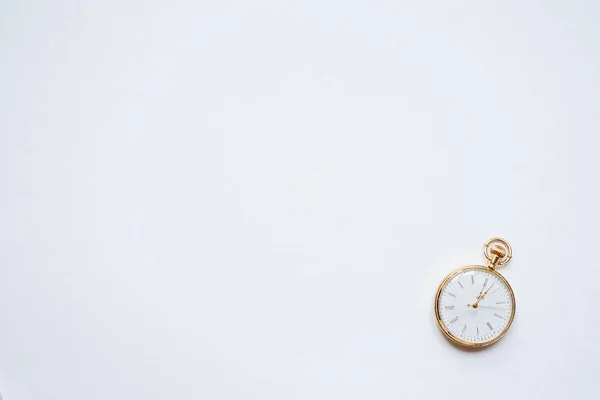 close up of vintage golden clock isolated on white background