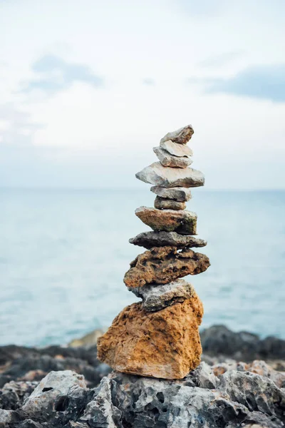 pyramid from meditation stones on sea background