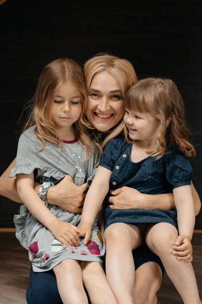 Young Attractive Mother Her Two Lovely Daughters Sitting Mother Lap — Stock Photo, Image