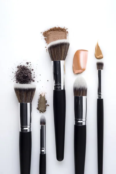 Creative concept beauty fashion photo of cosmetic product make up brushes kit with smashed lipstick eyeshadow on white background. — Stock Image Creative Concept Beauty Fashion Photo Cosmetic Product Make Brushes Kit Stock Image