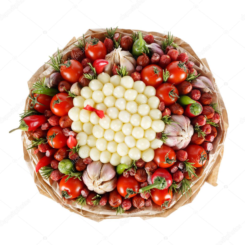 Unique tasty edible gift for a man in the form of a bouquet consisting of sausage, cheese, tomatoes, pepper and garlic isolated on a white background. Top view