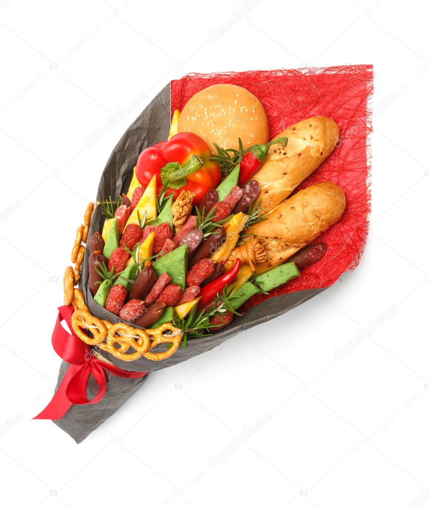 Wheat bread, sesame bun, cheese of different varieties, sausages and paprika are wrapped in grey and red paper as a gift bouquet on a white background