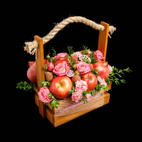 Unique gift wooden box with flowers and fruits isolated on black background. Left view