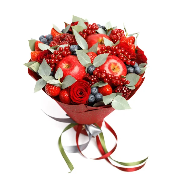 Beautiful bright red edible bouquet of strawberries, pomegranates, apples, blueberries and roses on a white background