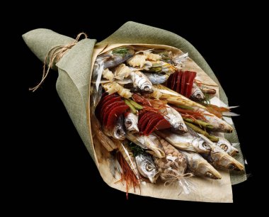 Bouquet consisting of dried fish, chips, pistachios and snacks on a black background as a gift to her husband clipart
