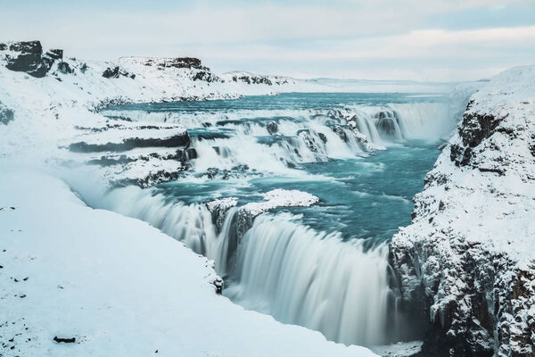 Gullfoss waterfall view in the canyon of the Hvita river during winter snow Iceland