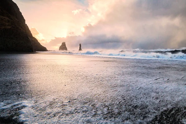 Reynisfjara or better known as Black Sand beach view during sunrise