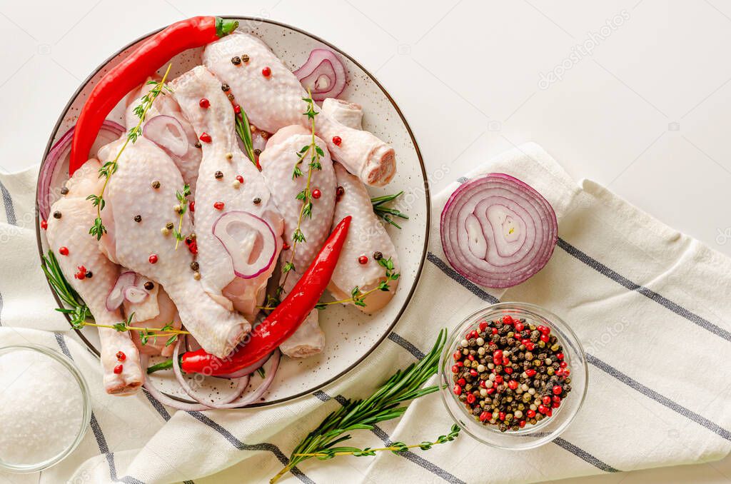 Raw chicken legs or drumsticks. Spicy marinate ingredients. Flat lay, copy space