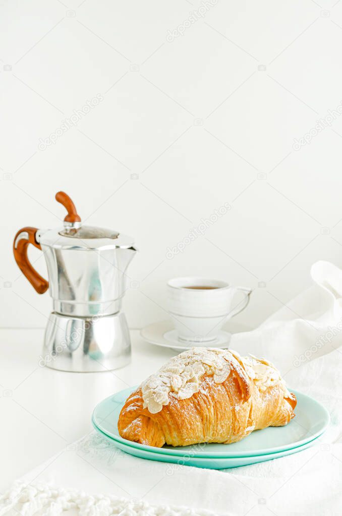 Breakfast and snack background. Fresh croissants and coffee on white table. Vertical