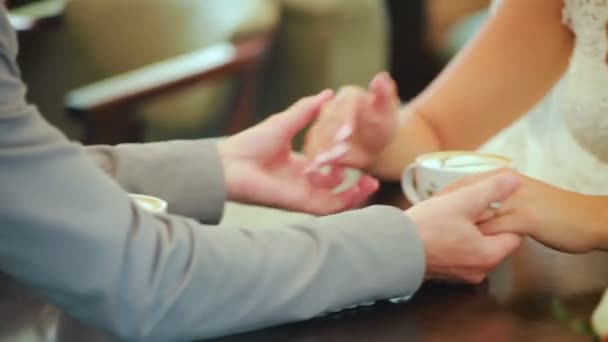 Closeup Of Cute Couple Reaching Across Table To Hold Hands — Stock Video