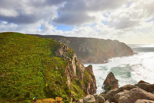 Cabo da Roca, Portugal. Lighthouse and cliffs over Atlantic Ocean, the most westerly point of the European mainland.