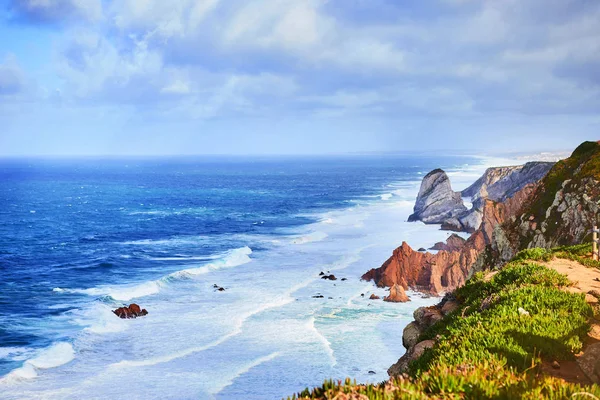 Cabo da Roca, Portugal. Lighthouse and cliffs over Atlantic Ocean, the most westerly point of the European mainland.