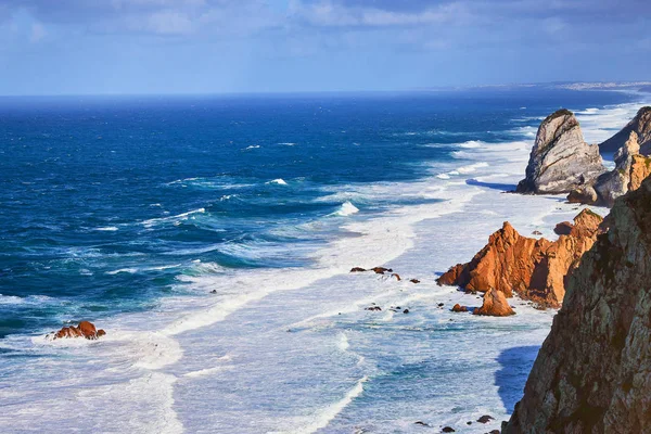 Cabo da Roca, Portugal. Lighthouse and cliffs over Atlantic Ocean, the most westerly point of the European mainland.