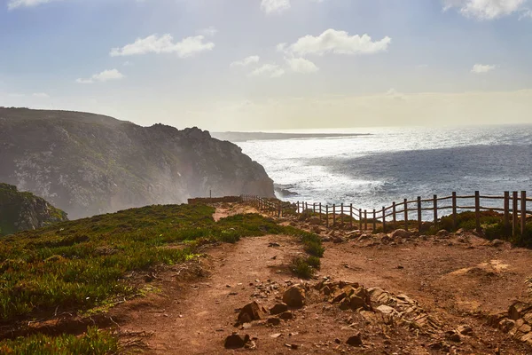 Cabo da Roca, Portugal. Lighthouse and cliffs over Atlantic Ocean, the most westerly point of the European mainland.