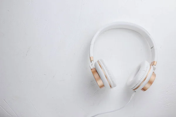 White headphones on white background
