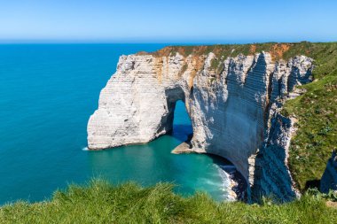 Aiguille Etretat cliff on the sea side and its beautiful limestone cliffs clipart