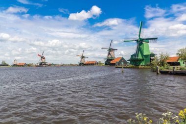 Traditional Dutch windmills at Zaanse Schans closed to Amsterdam clipart