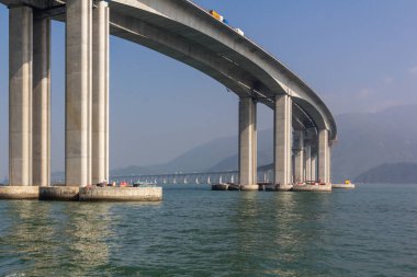 Hong KongZhuhaiMacau Bridge ongoing construction project consisting of a series of bridges and tunnels crossing the Lingdingyang channel to connect Hong Kong, Macau and Zhuhai, three major cities on the Pearl River Delta in China.  clipart