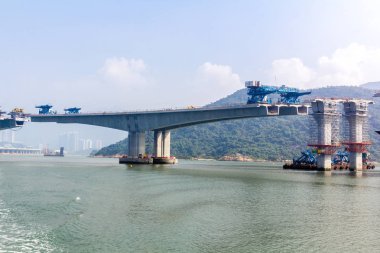 Hong KongZhuhaiMacau Bridge ongoing construction project consisting of a series of bridges and tunnels crossing the Lingdingyang channel to connect Hong Kong, Macau and Zhuhai, three major cities on the Pearl River Delta in China.  clipart