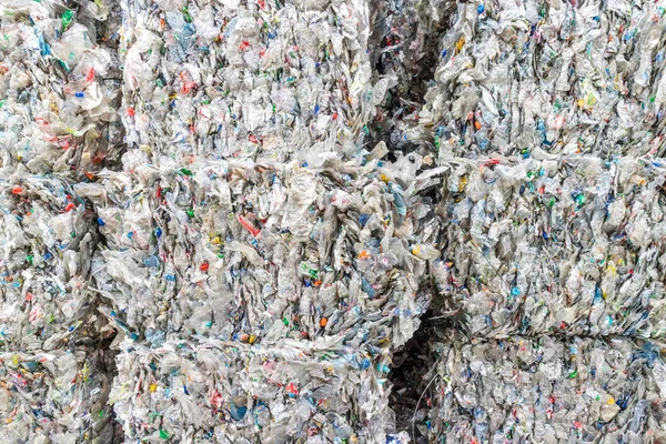 Plastics recycling centers and raw material — Stock Photo, Image