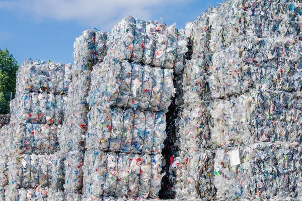 Plastics recycling centers and raw material — Stock Photo, Image