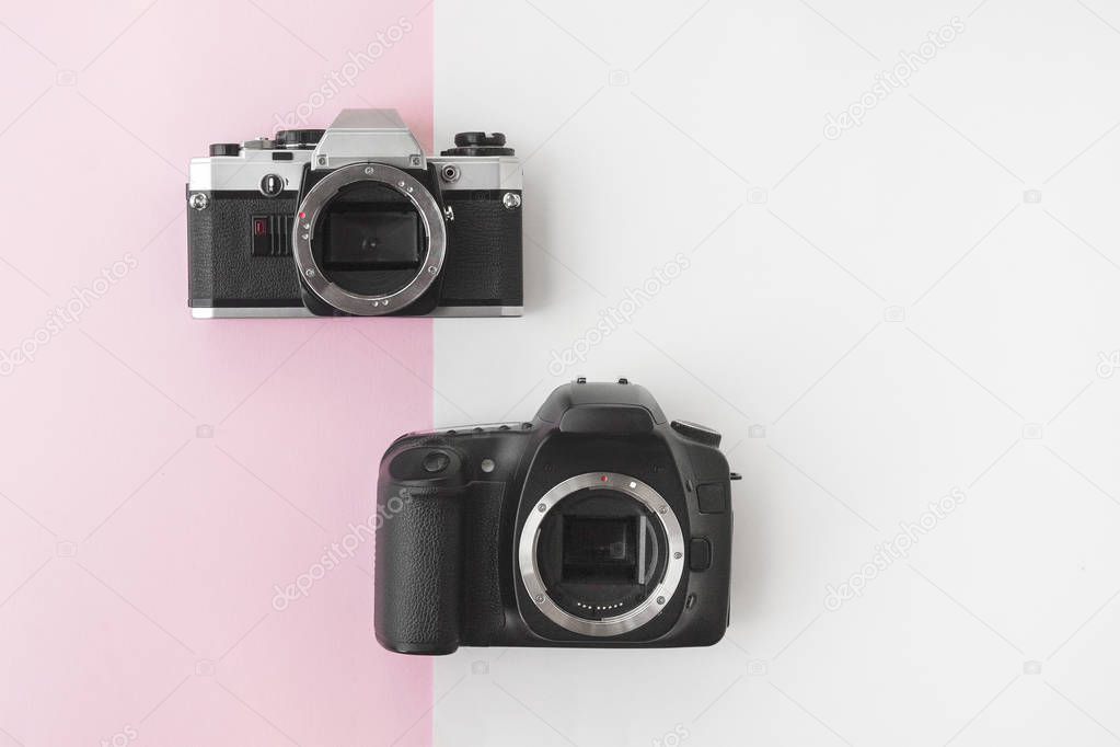 Digital versus Analog SLR Camera on Pink Background with Copyspace