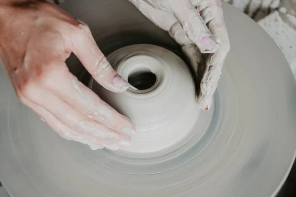 Top view of clay products, on a pottery wheel with copy space