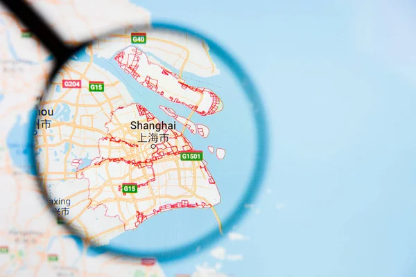 Shanghai, China city visualization illustrative concept on display screen through magnifying glass