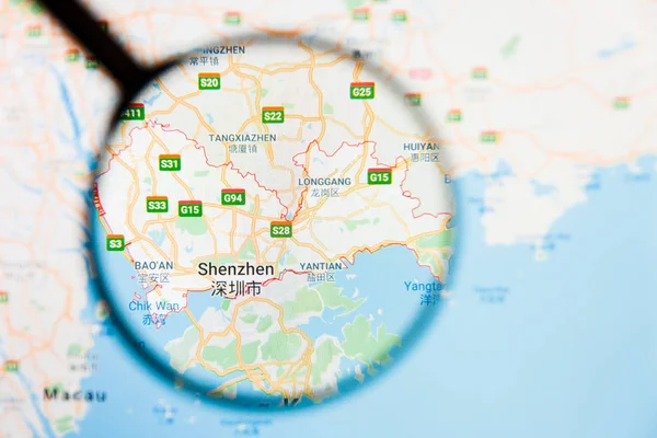 Shenzhen, China city visualization illustrative concept on display screen through magnifying glass — Stock Photo, Image