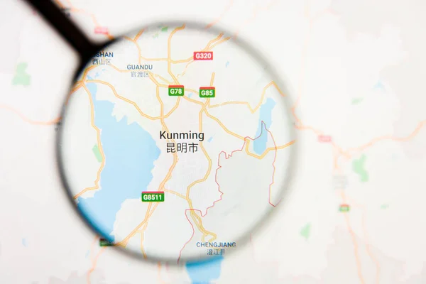 Kunming, China city visualization illustrative concept on display screen through magnifying glass