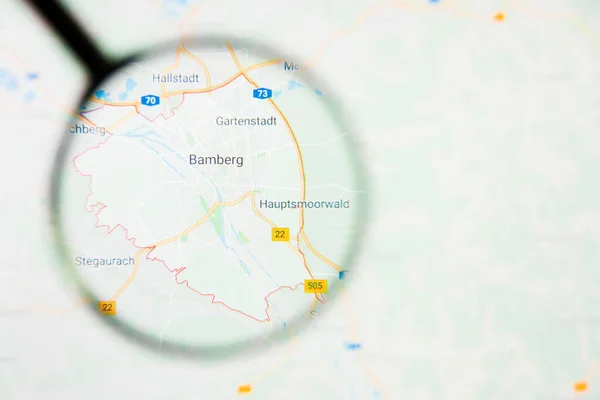 Bamberg city in Germany, Bavaria visualization illustrative concept on display screen through magnifying glass