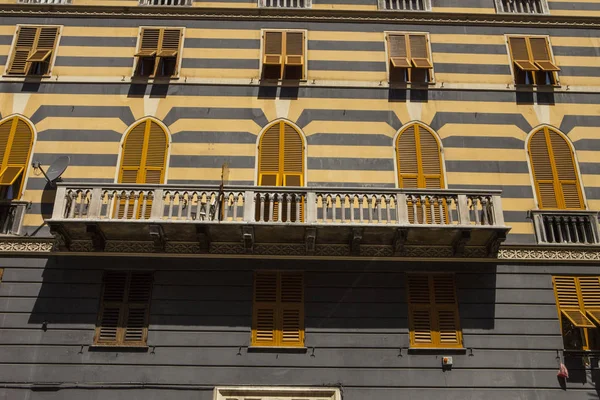 Genoa, summer streets, exterior details on the streets, roofs, lights and doors, windows, Genoa roads. Plaza Christopher Columbus, parks, Museum of Genoa, ports of anglers. Genova italian Madonna sculpture frescoes on houses