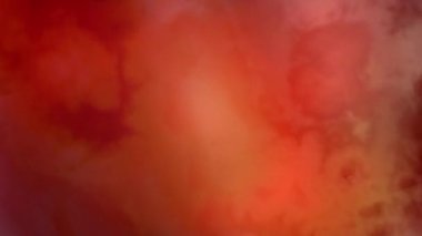 Hareketli soyut duman dinamik turuncu ve yeşil tonlarda kıvrılıyor, enerjik arka planlar için mükemmel.