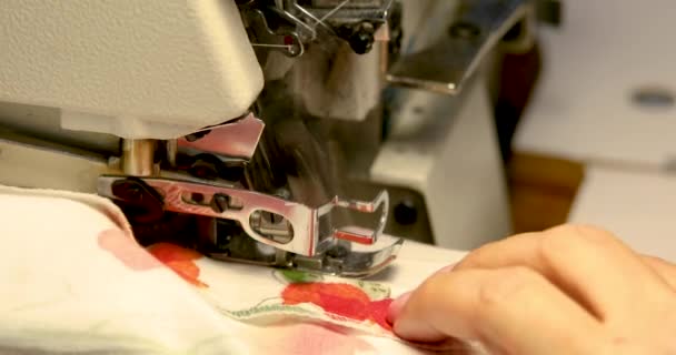 Professional sewing machine overlock with white fabric close-up — Stock Video