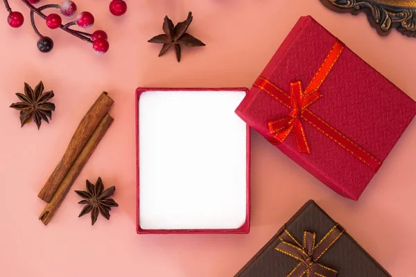 Open gift box on pink background. Empty space for message inside the box. Top view. Xmas and New year\'s day concept.